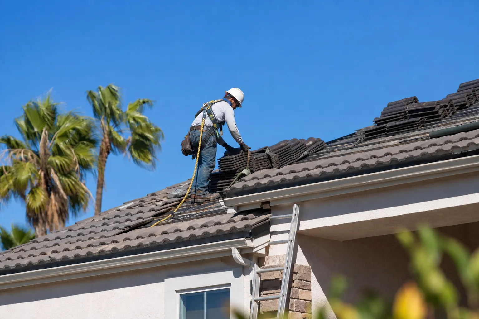Roofer installing new tile roof